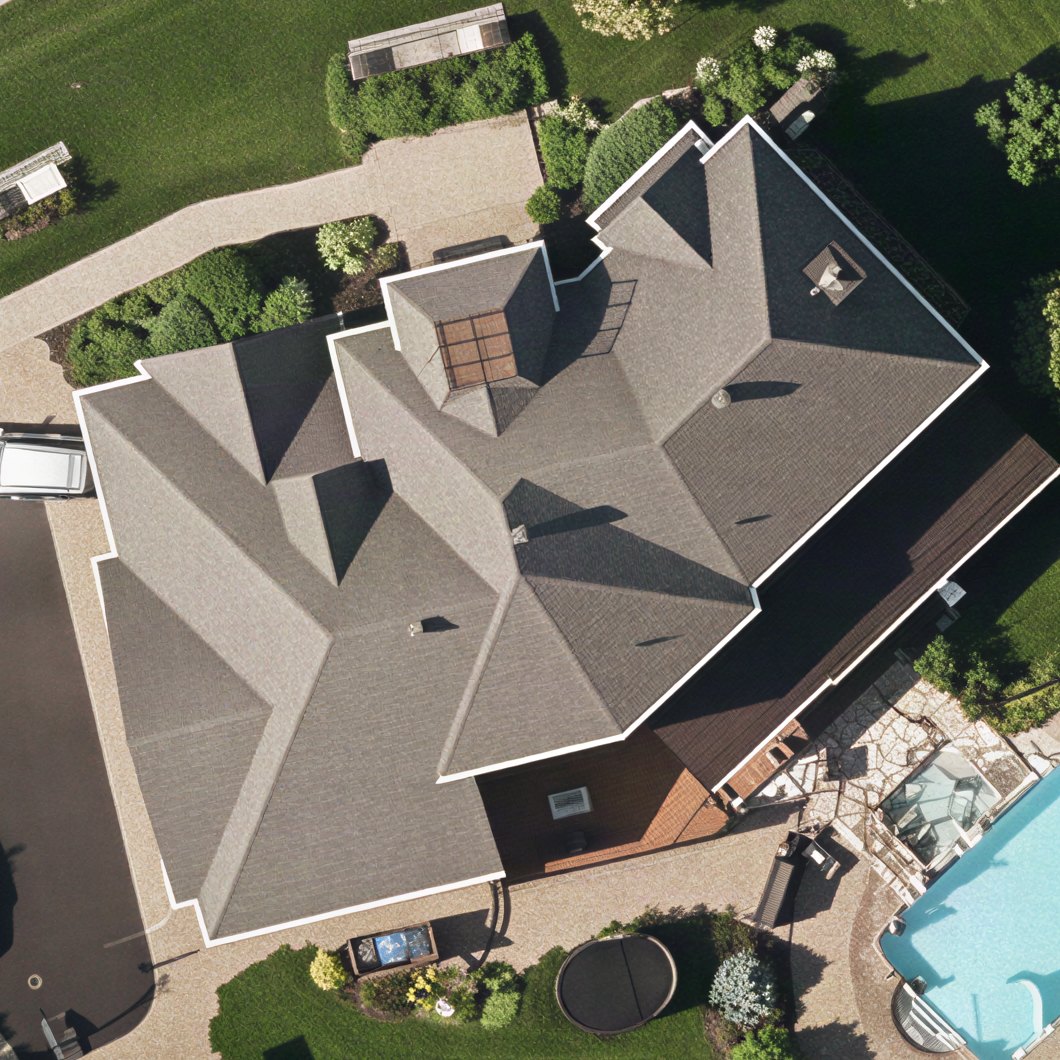 A home seen from above, with every gutter run traced and measured